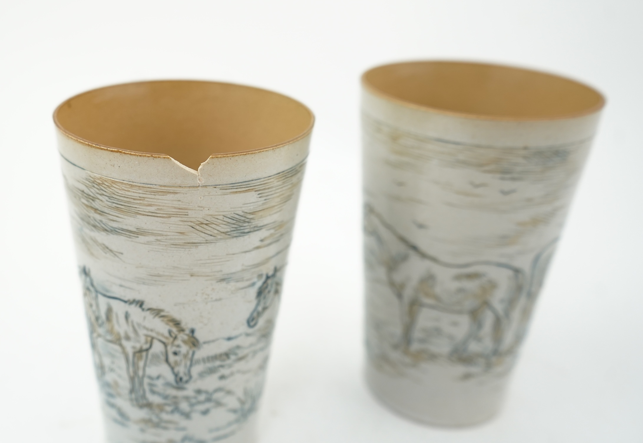 Hannah Barlow for Doulton Lambeth: A Stoneware Lemonade jug and two beakers